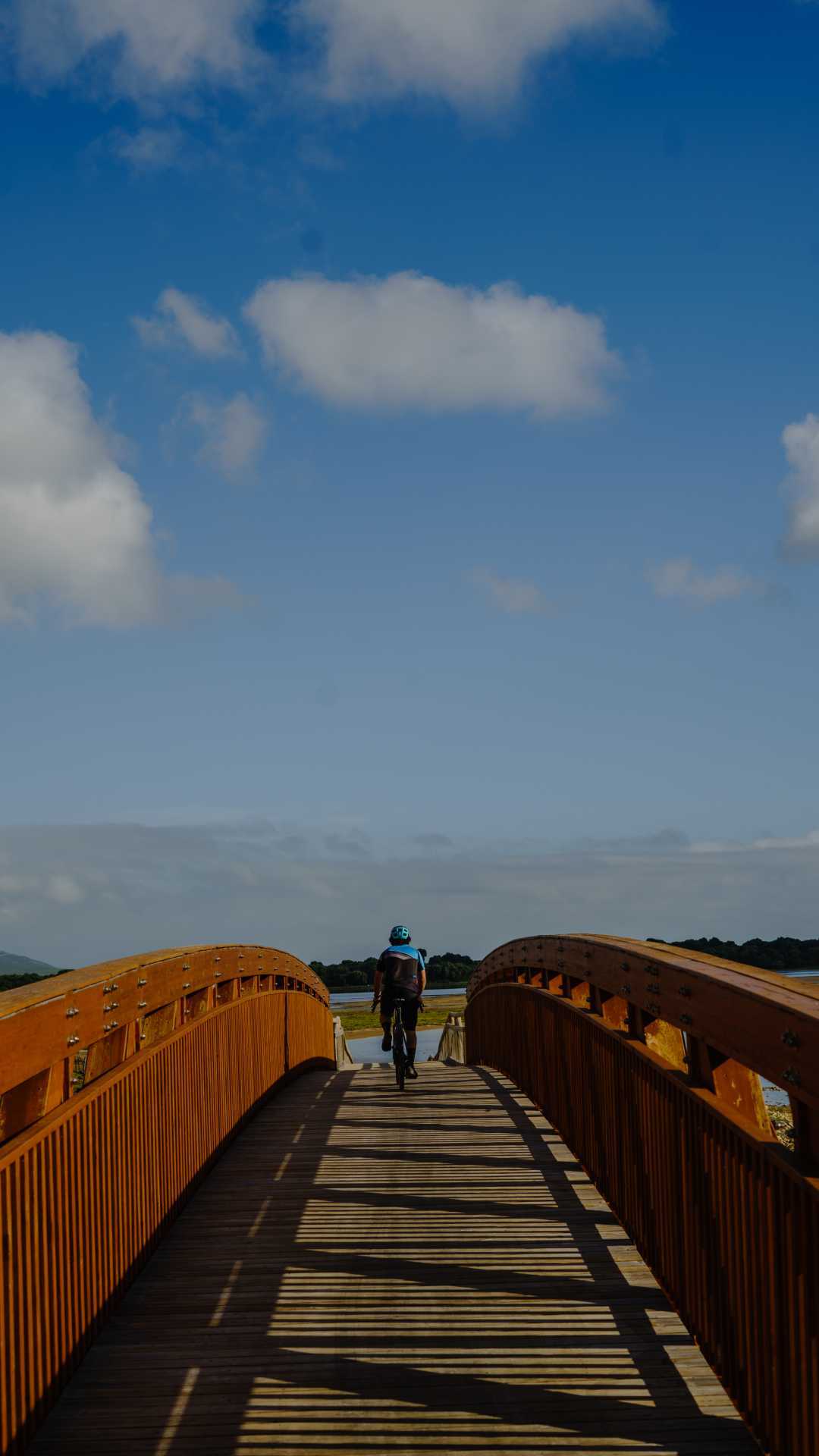 Biking along a steel bridge Biking along a steel bridge