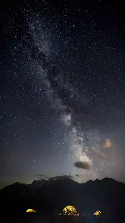 A star-studded sky above the tents captured on a clear night at Basecamp