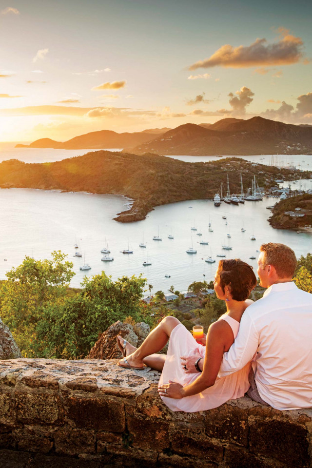 Couple overlooking Falmouth harbour in Antigua Couple overlooking Falmouth harbour in Antigua