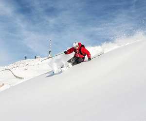 Skiier takes on the slopes in Kitzbuhel