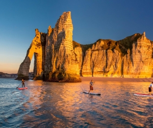 Normandy: Etretat beach with stand up paddleboarders