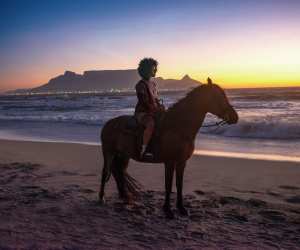 Riding a horse on a beach in South Africa