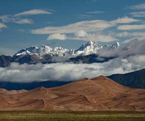 The Great Sand Dunes in Colorado with mountainous backdrop