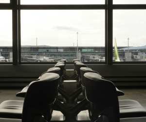 A row of chairs sitting in front of a window