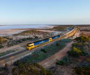 The Indian Pacific passing Lake Julia, in Western Australia