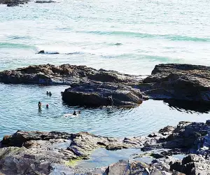 Wild swimming on the coast of Cornwall, UK