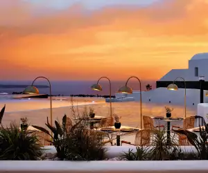 Sunset over the pool at Santo Maris Oia