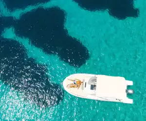 A couple relax on a boat