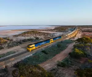 The Indian Pacific passing Lake Julia, in Western Australia